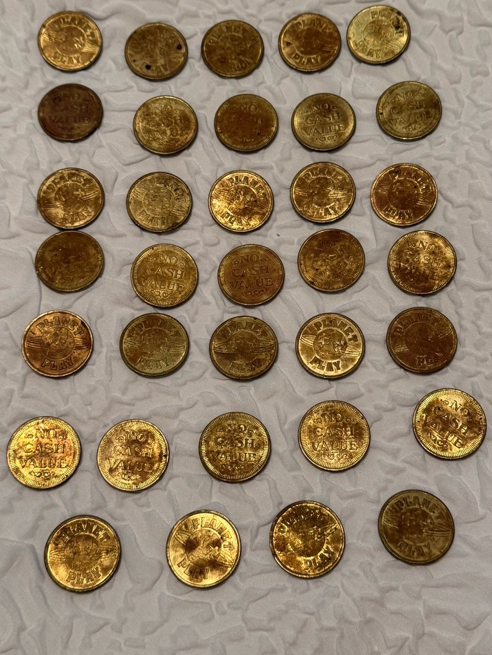 Planet Play arcade tokens - Lot Of 34 - brass - used - vintage 1980's-1990's
